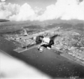 A Vickers Vildebeest Mk III of No. 36 Squadron RAF in flight over Singapore City