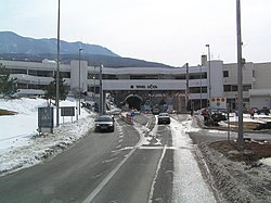 Mainline toll plaza ahead of tunnel portal and administrative building